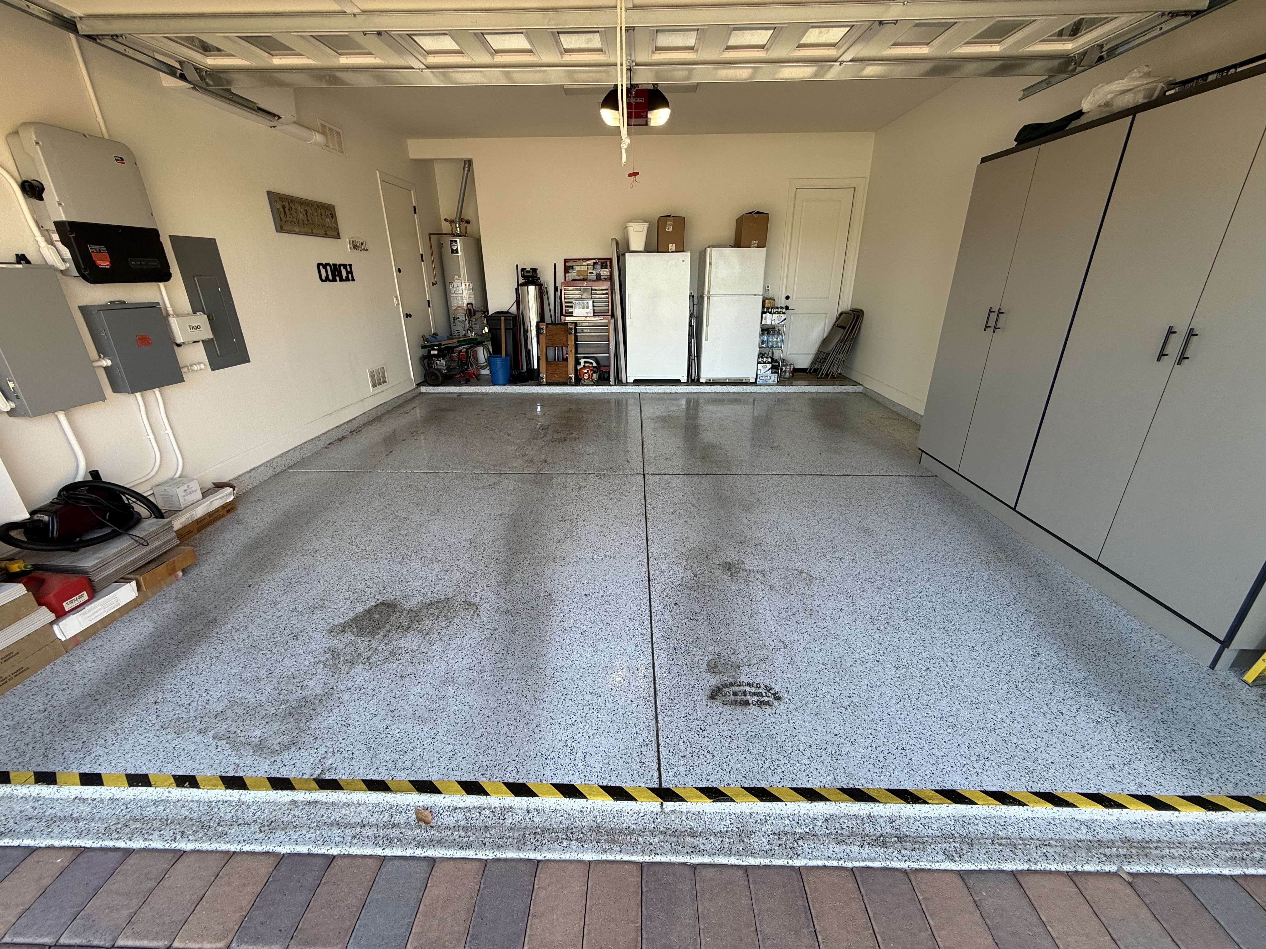 Stained garage floor before cleaning