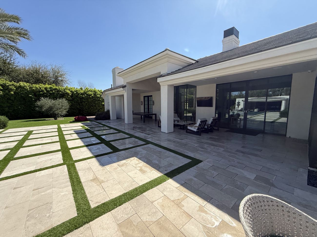 Spotless travertine pool deck and patio after pressure washing